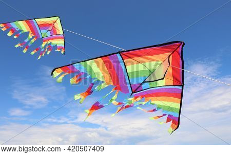 Two Big Incredible Colorful Kites Flying High In The Sky, Symbol Of Freedom And Lightheartedness