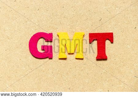 Color Cloth Alphabet Letter In Word Gmt (abbreviation Of Greenwich Mean Time) On Wood Background