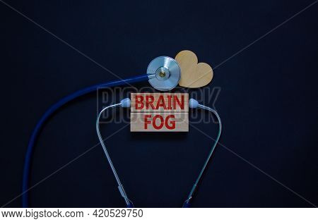 Medical, Covid-19 And Brain Fog Symbol. Wooden Blocks With Words 'brain Fog' And Stethoscope On Blac