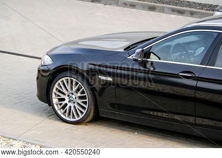 Ostrava, Czech Republic - April 29, 2021: The Left Frontal Part Of A Black Bmw 5-series Model F10 As