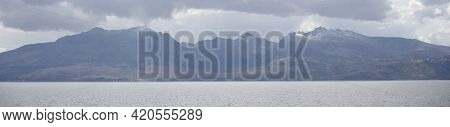 Arran Viewed From Rothesay In Isle Of Bute Under Dark Clouds