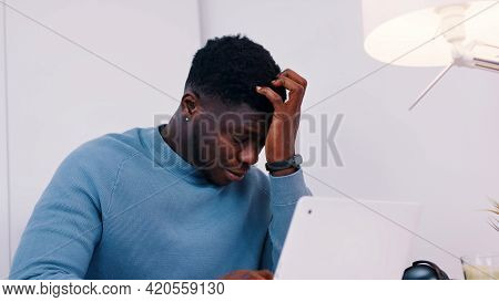 Stressed Out Man Working On His Laptop. Work Stress Or Work Load Concept. High Quality Photo