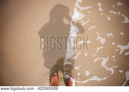 Photographer Taking Self Portrait By Reflection Shadow On Beach Sand. Top View. Summer Vacation. Har