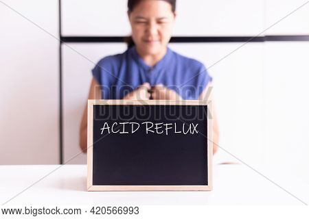 Woman Having A Reflux Acid With The Word Acid Reflux On Blackbroad,gastroesophageal Disease