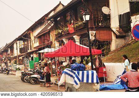 Lao People Sale Food Product In Louangphabang Walking Street Bazaar Market For Laotian And Foreign T