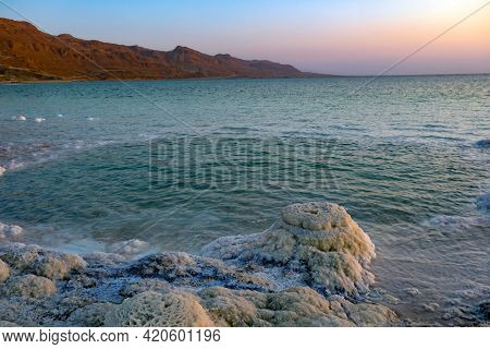 Salt Crystals On The Dead Sea Coast During Sunset