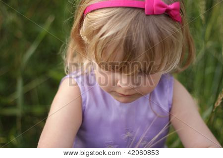 Blond Toddler With Pink Hairband