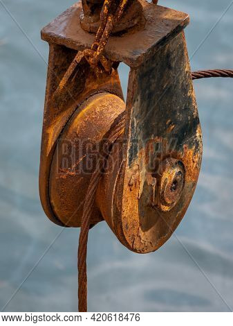 A Rusty Trawler Pully By The Sea