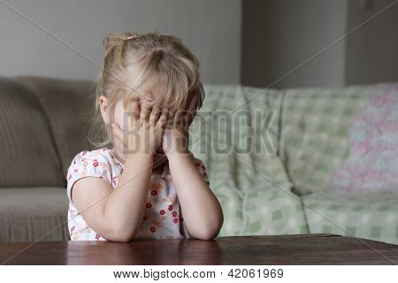 Little Girl Hiding Her Face