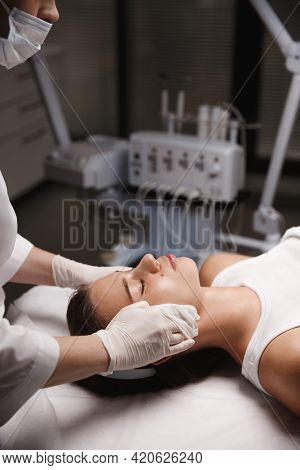 Skin Care And Rejuvenation Salon. Beautician Removes Cleansing Facial Product From Client Face, Prep