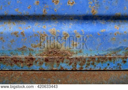Rusty Silver Metal Texture. Gray, Purple And Orange. Grunge Texture Of A Garage Wall.scratched Metal