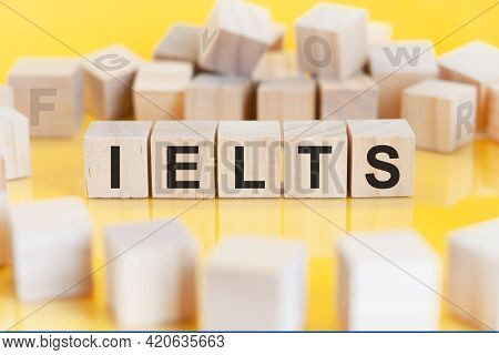 The Word Ielts Is Written On A Wooden Cubes Structure. Blocks On A Bright Background. Education, Fin