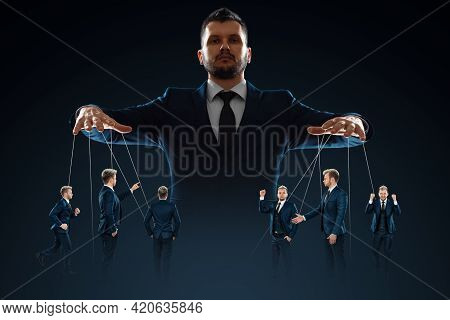 A Man, A Puppeteer, Controls The Crowd With Threads. The Concept Of World Conspiracy, World Governme