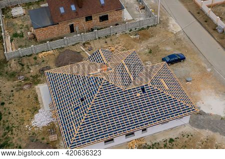 Kyiv- Dec 11 ,2019: Residential House With Wooden Roof Frame Structure Under Construction. Unfinishe