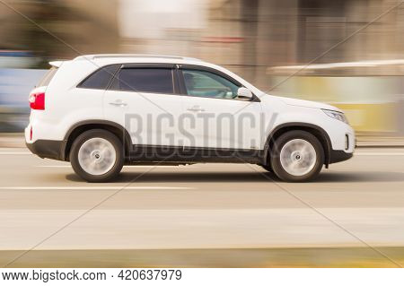 Kia Sorento Second Generation Xm Rides On City Road. Overspeed In City Concept. White Suv In Motion 