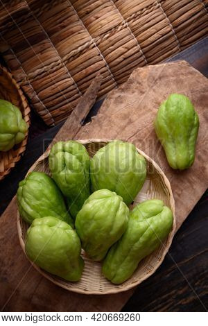 Chayote Squash Fruit (mirliton, Pipinola Or Choko) In A Basket On Wooden Background, Edible Fruit Ea