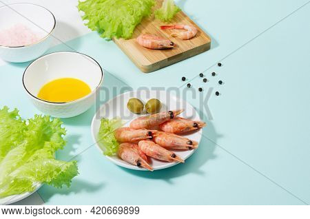 Healthy Lifestyle - Cooking Of Fresh Salad Of Prawn, Green Salad, Olive, Black Pepper, Pink Salt In 