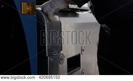 Professional Equipment At The Car Repair Center. Scene. Close Up Of Man Mechanic Hands Opening A Cov