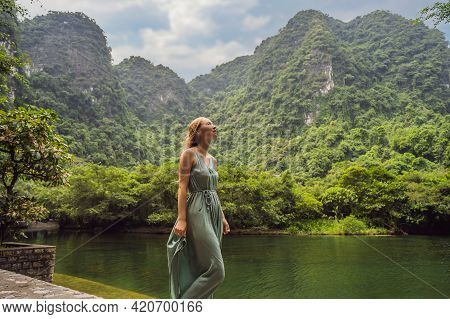 Woman Tourist In Trang An Scenic Landscape Complex In Ninh Binh Province, Vietnam A Unesco World Her