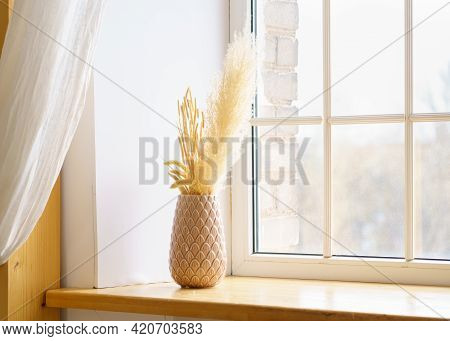 Reed Plume Stem, Vase With Dry Flower On Window, Dried Pampas Grass. Decorative Flower Arrangement I