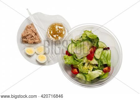 Fresh Tuna Salad With Lettuce, Cucombers, Cherries And Eggs In Plastic Container.  Top View.