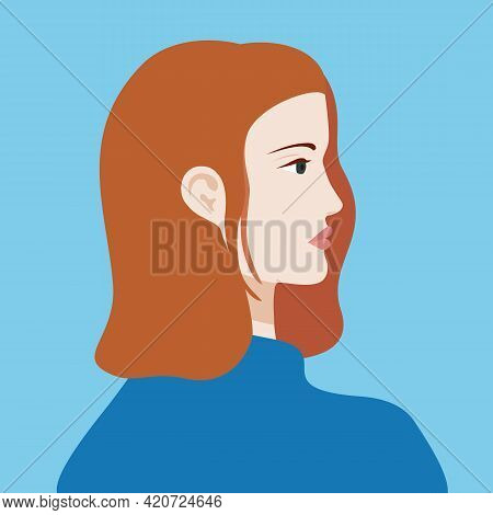 Portrait Of A Red Haired Woman In Blue Sweter. The Head Of A European Girl In Profile. Social Media 