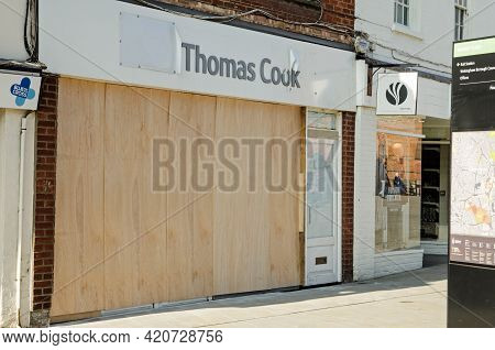 Wokingham, Uk - February 28, 2021: A Boarded Up Branch Of The Defunct Travel Agency Thomas Cook In W