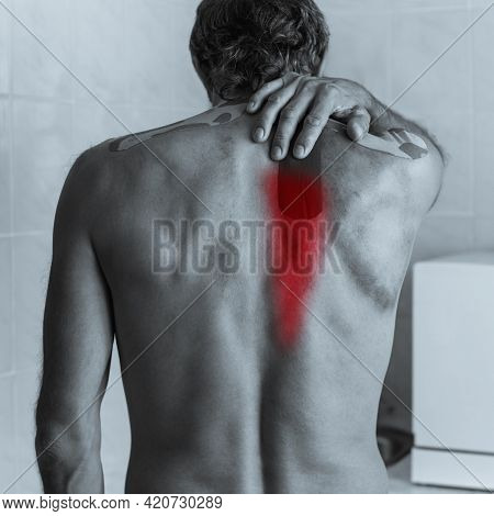 Black And White Photo Of Shirtless Sick Man Touching His Back