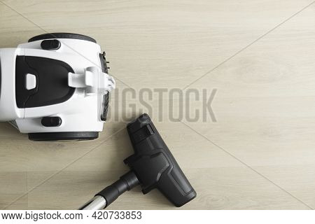 Bagless Cyclone Vacuum Cleaner On A Laminate. Electrical Apparatus That By Means Of Suction Collects
