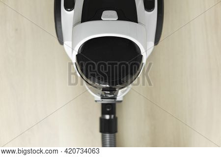 Bagless Cyclone Vacuum Cleaner On A Laminate. Electrical Apparatus That By Means Of Suction Collects