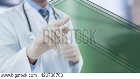 Composition of midsection of male doctor wearing surgical gloves touching interactive screen. global medicine and technology concept digitally generated image.