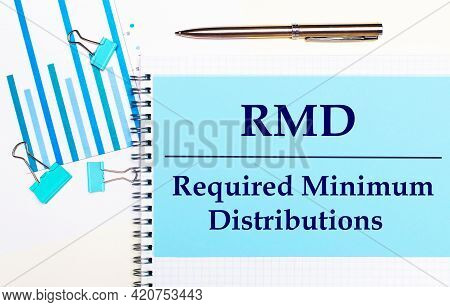 On A Light Background - Light Blue Diagrams, Paper Clips And A Sheet Of Paper With The Text Rmd Requ