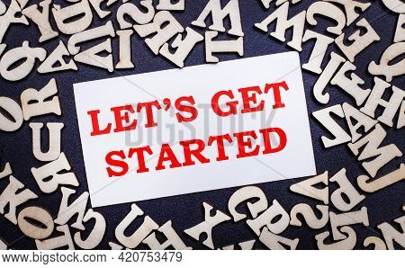 On A Light Background, Wooden Letters Of The English Alphabet And A White Card Inside With The Words