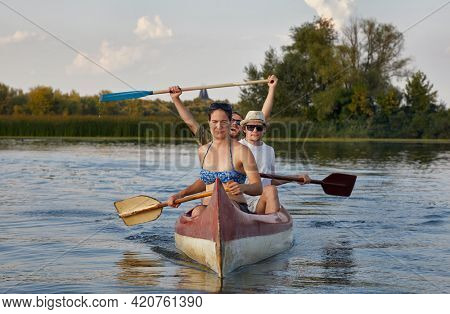Canoeing in late afternoon sunlight, Lake Tisza, Hungary