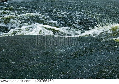 The Texture Of Water On The Surface Of A Small Waterfall In The Ukrainian Steppe Close-up. Tokovsky