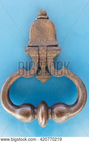 European Vintage Old Metal Wrought Iron Door Knocker. Design Detail. Paris.