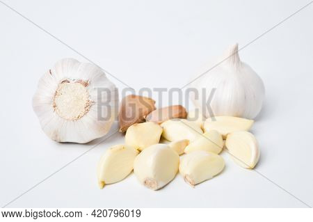 Fresh Garlic Isolated On A White Background. Garlic Is A Species In The Onion Genus, Allium.