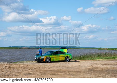 Cypremort Point State Park, La - May 13: Man Fishes From The Hood Of His Customized Car With Changin