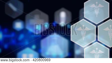 Composition of network of medical icons on hexagons over glowing blue background. global science, medicine and research concept digitally generated image.