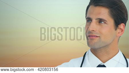 Portrait of caucasian male doctor against brown gradient background. healthcare and medical research technology concept