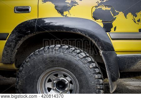 World Traveller Off Road Vehicle. A World Map Is Painted Over Rear Wheel