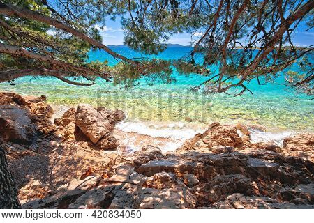 Idyllic Turquoise Beach View Through Pine Tree In Zadar Riviera, Pakostane In Dalmatia Region Of Cro