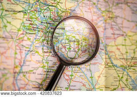Close-up Map Of Coventry Through Black Magnifying Glass, City In England, United Kingdom