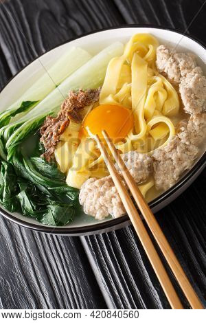 Ban Mian Minced Pork Noodle Soup Handmade Closeup In The Bowl On The Table. Vertical