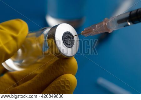 The Syringe From The Ampoule Is Taking The Medicine