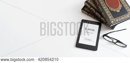 E-book Reader With Traditional Books Composition. Book Reading With E-book Device Concept