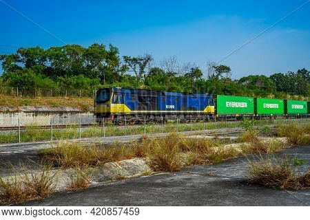 Chonburi Province, Thailand - 21 Nov 2020, The Evergreen Container On The Train Is Driven On Rural R