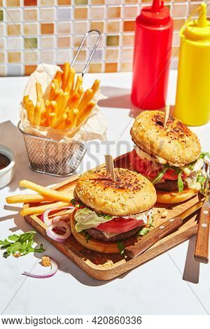 Delicious Homemade Burgers On Wooden Tray In Bright Sunlight. Burgers With Veal Cutlet, Pamidor, Che