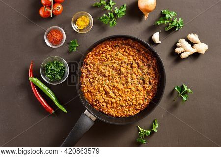 Keema Curry In Frying Pan Over Dark Background. Indian And Pakistani Style Dish. Top View, Flat Lay,