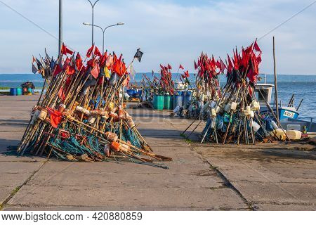 Krynica Morska, Poland - May 15, 2021: Fishing Red Flags In Port Of Krynica Morska Located On The Vi